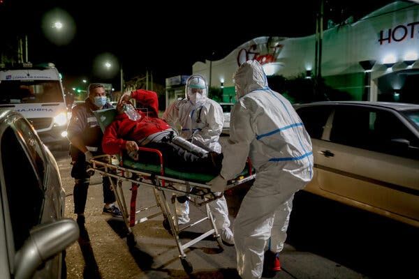 Medical personnel transport a patient to an ambulance in Lomas de Zamora, Argentina last week.
