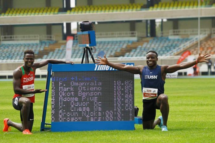 Mark Otieno (l) and Ferdinand Omanyala (R) pose after running Olympic-qualifying times in the Team Kenya trials held at Kasarani Stadium on June 17, 2021. 