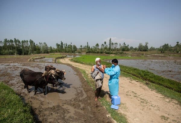 Administrating a vaccine this month to a farmer in the village of Minnar, north of Srinagar, in the Indian-controlled part of Kashmir.