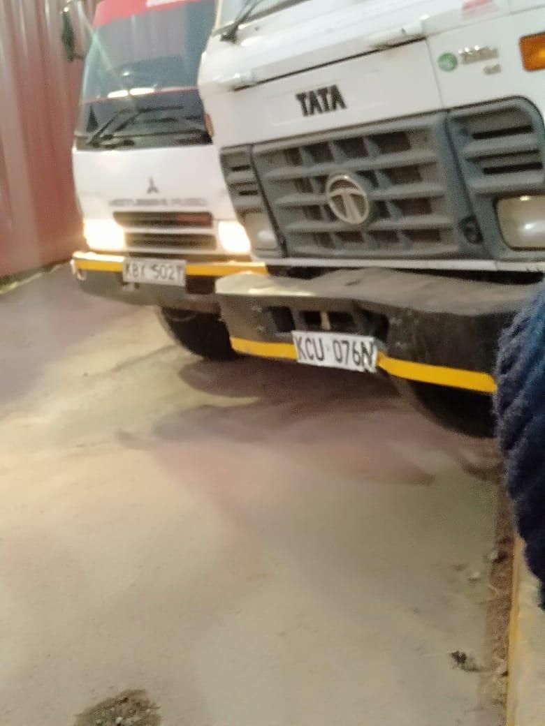 Two trucks which this week hurriedly offloaded the materials just at the break of dawn
