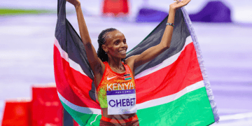 Beatrice Chebet, Kenya’s 10,000m and 5,000m world champion, being honored and promoted to the rank of Sergeant of Police by Deputy Inspector General Eliud Lagat