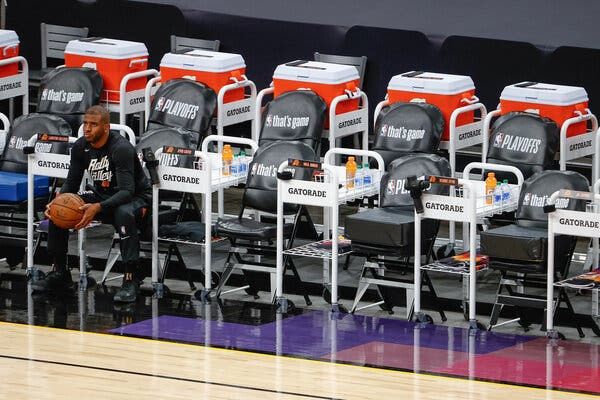 Chris Paul, of the Phoenix Suns, sits on the bench before playing the Los Angeles Lakers in May in Phoenix.