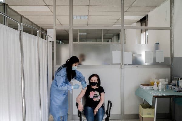 A health care worker administered a dose of the AstraZeneca vaccine in March at a hospital in Milan.