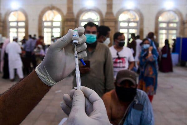 A vaccination center in Karachi, Pakistan, this month. Critics say private sales in Pakistan and around the world make inoculations available only to the wealthy.