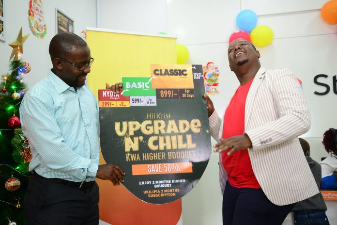 Webp.net-compress-image (12) Aldrine Nsubuga StarTimes Regional Marketing Director (left) and Content Director Myke Mwai gestures during the upgrade campaign launch.