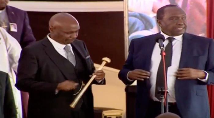 gideon moi l examines his late fathers rungu which was handed to him by his brother raymond moi r gideon moi l examines his late fathers rungu which was handed to him by his brother raymond moi r