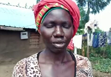 A photo of Milly Nafula taken at her workstation on December 8, 2021.