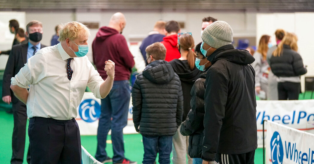 Britain can ‘ride out’ the Omicron wave without a strict lockdown, Boris Johnson says.