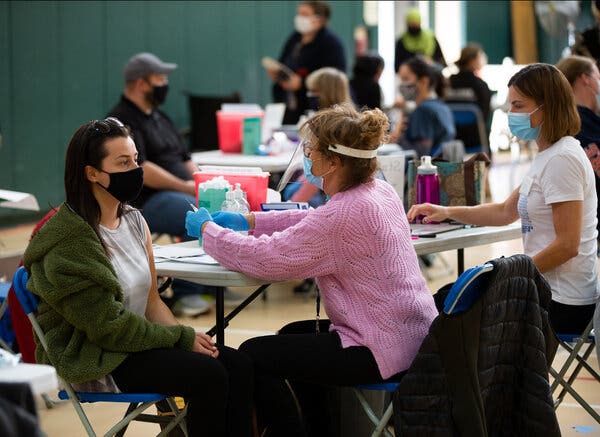 Registered nurse Angela Biccolo administered the Moderna Covid vaccine to a school teacher during a clinic for teachers and school administrators at the Rumney March Academy, in Revere, Mass., in March.