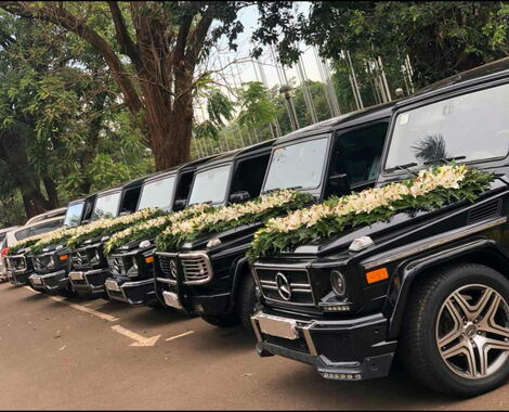 Mercedes Benz G Wagons fitted with wedding decorations.