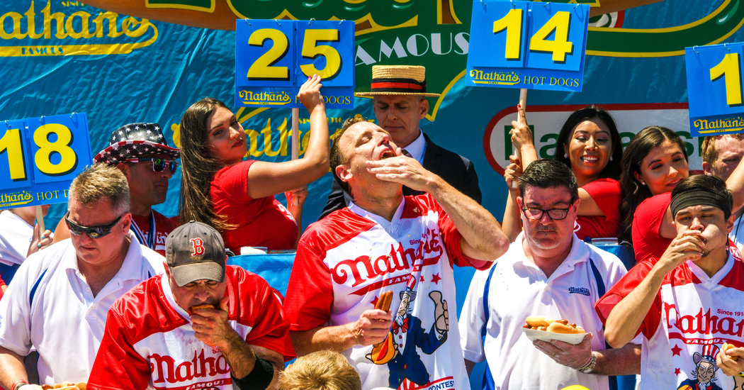 With Plexiglass and Piles of Hot Dogs, a Fourth of July Tradition Lives On