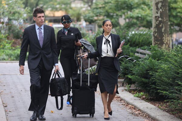 Thomas Farinella and Nicole Blank Becker, part of R. Kelly’s defense team, arrived at federal court in Brooklyn on Thursday.