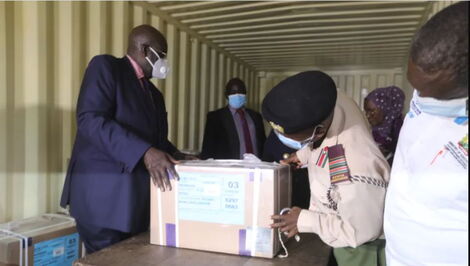 Education CS George Magoha (left) oversees the opening of KCSE examinations