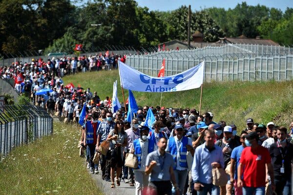 Airbus employees protesting cutbacks. The aircraft maker said it would eliminate 15,000 jobs.