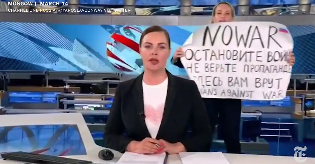 Anti-War Protester Storms a Live Broadcast on Russia’s Most-Watched News Show