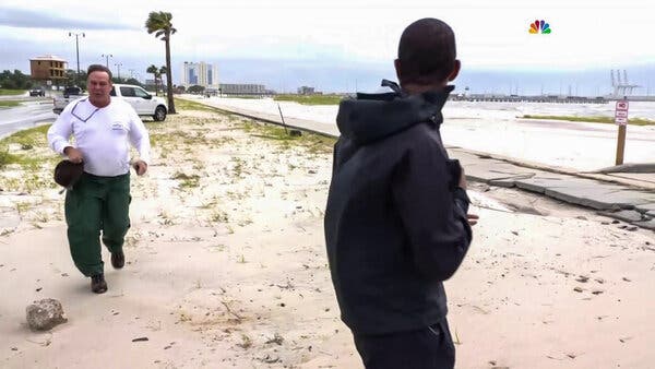 A man identified as Benjamin Eugene Dagley, left, confronted Shaquille Brewster, an NBC reporter, as Mr. Brewster covered Hurricane Ida.