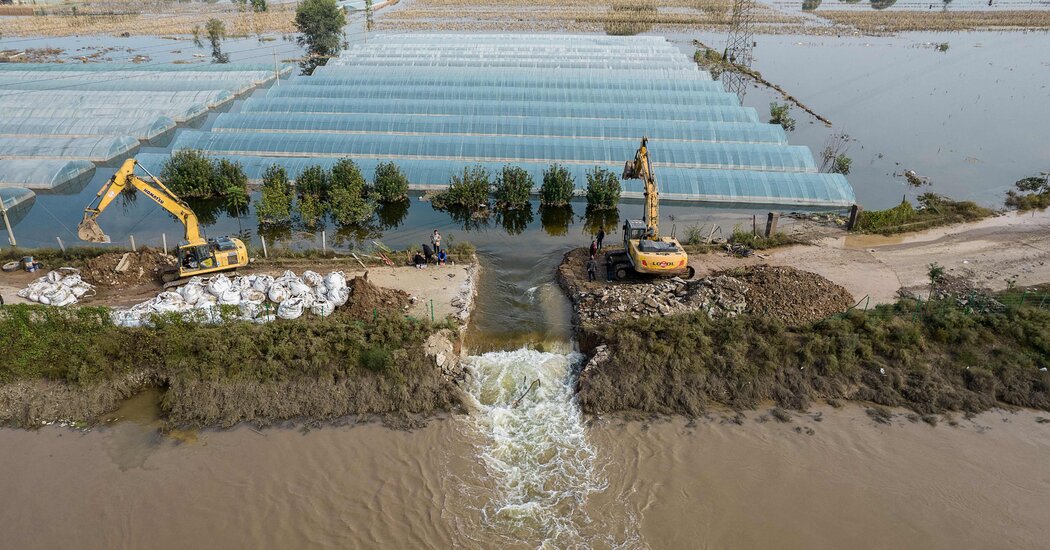 As Floods Ravage China, 13 Die After Bus Falls Off Bridge