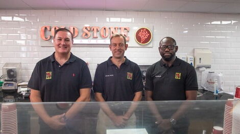 The managers that oversaw the launch of the new Domino's outlet