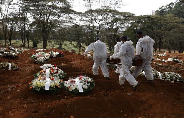 Cemetery workers in São Paolo, Brazil, carrying the coffin of someone who died of Covid-19 this month.