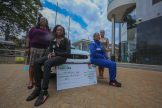 Rally Driver Maxine Wahome (R) and her co-driver Linet Ayuko (L) pose for a picture after Safaricom’s sponsorship cheque handover - Bizna Kenya