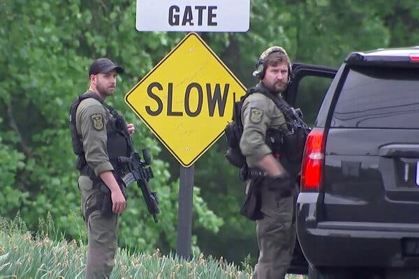 Law enforcement officers near the entrance to the headquarters of the Central Intelligence Agency in Langley, Va., after an F.B.I. involved shooting on Monday evening.