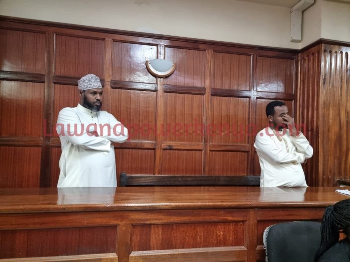 Two charged with money laundering.