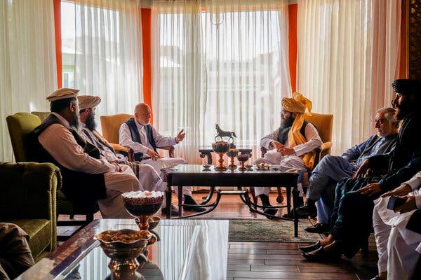 In a handout photograph released by the Taliban, former President Hamid Karzai, center left, met in Kabul last week with  Abdullah Abdullah, second from right, and a  Taliban delegation including Anas Haqqani, center right.