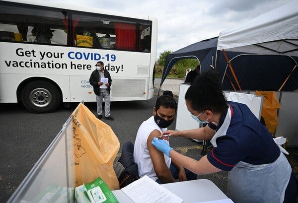 Administering a coronavirus shot at a temporary vaccination center in Bolton, England, this month.