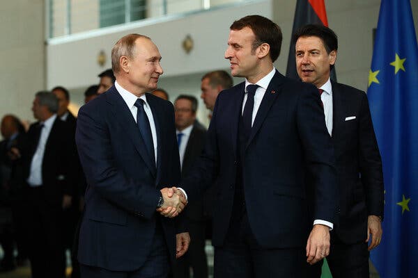 President President Vladimir V. Putin of Russia greeted President Emmanuel Macron of France in Berlin in January 2020.