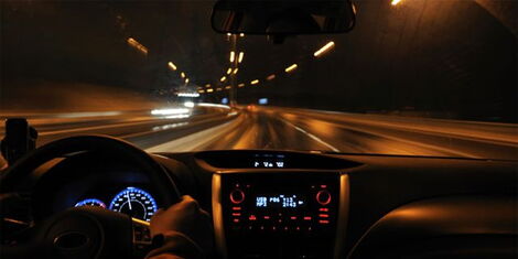 Individual driving through the night