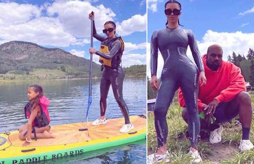 Kim Kardashian and Kanye West force smiles for family day at lake amid divorce rumours