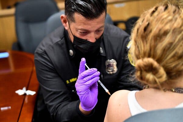 A paramedic administered a Covid-19 vaccine dose in Culver City, Calif., this month.