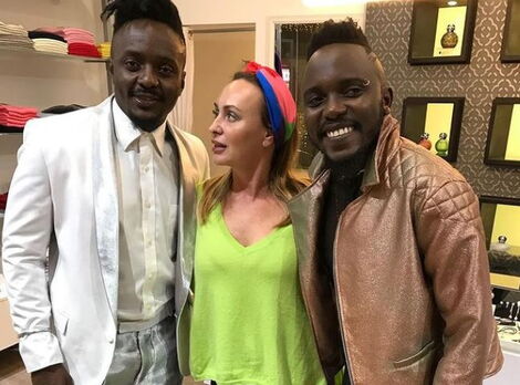 Business Mogul Elena Kuoni poses for a photo alongside Sauti Sol's Savara and Chimano in December 2017.