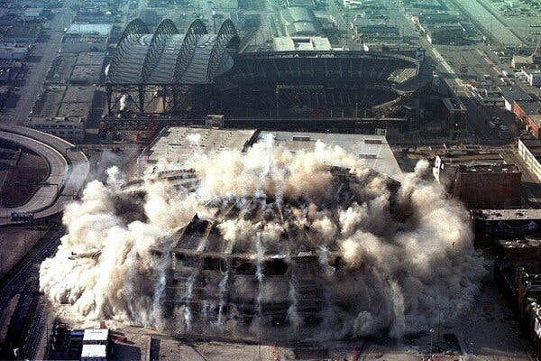 The Seattle Kingdome collapsing during its implosion in Seattle in 2000.