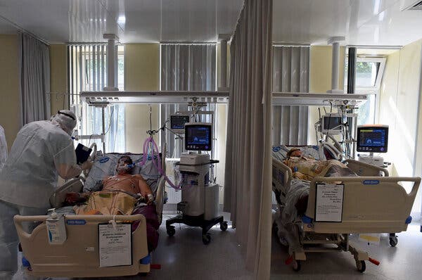 A medical worker tended to patients infected with the coronavirus at Marlinksy Hospital in Saint Petersburg, Russia, on Wednesday.