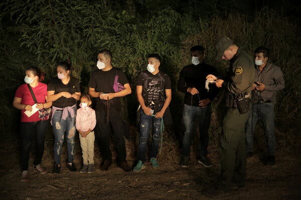 Migrants were lined up and processed by Border Patrol north of the Roma–Ciudad Miguel Aleman International Bridge, which spans the Rio Grande border with Mexico, in Roma, Texas, U.S. October 1, 2021