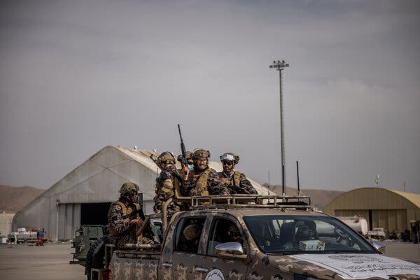 Members of the Taliban Badri 313 battalion on Tuesday at the airport in Kabul.