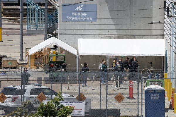 Police and investigators at the scene of the shooting, where eight people were killed.