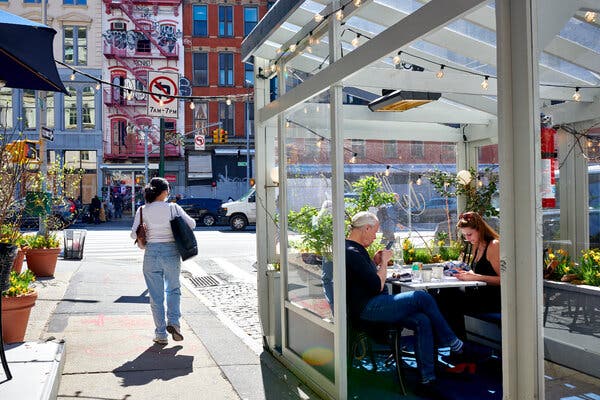 Customers dine outside at a restaurant in the Soho neighborhood of New York, New York on Tuesday, April 13, 2021.