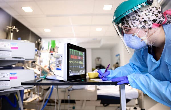 A medical worker monitored a Covid-19 patient in the intensive care unit at Lake Charles Memorial Hospital in Louisiana earlier this month.