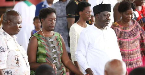 Former Prime Minister Raila Odinga (second right) and his daughter Rosemary (second left) attend a church function.