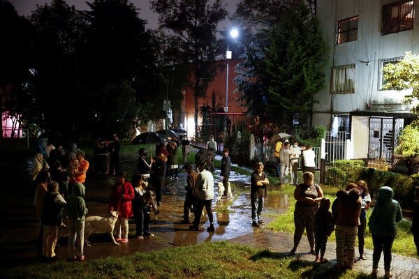 Residents in Mexico City after a strong earthquake sent them outside.
