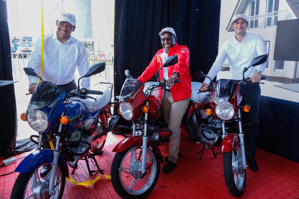 Vivo Energy Executive President East and South Regions, Hans Paulsen (left) Vivo Energy Kenya Managing Director, Peter Murugi (center) and Vivo Energy Kenya Retail Manager, Saadallah Adel (right) pose for a photo on motor bikes that are up for competitions - Bizna Kenya
