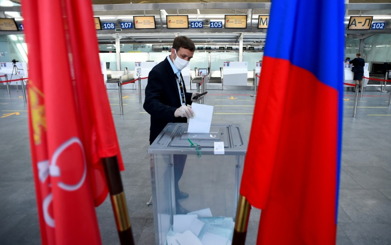 Russians cast early votes in ballot to extend Putin's rule » Capital News