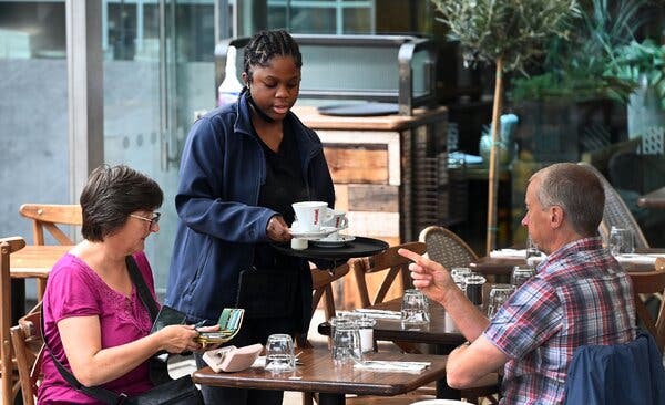 Serving customers at a restaurant in London in August. Data showed that food businesses were among those most in need of employees in Britain.
