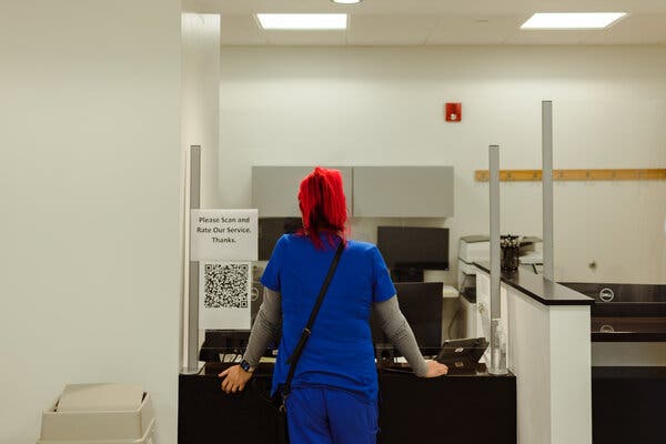 Gloria Molina, 28, checked in for her second dose of the vaccine at Samuel Rodgers Health Center in Kansas City, Mo.