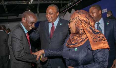 Marathoner Eliud Kipchoge (left), President Uhuru Kenyatta (center) and his Tanzanian counterpart Suluhu Hassan at Glasgow Conference in Scotland on Tuesday, November 2, 2021.