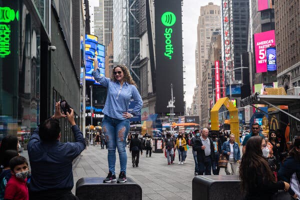 Visitors at Times Square in Manhattan on Thursday.