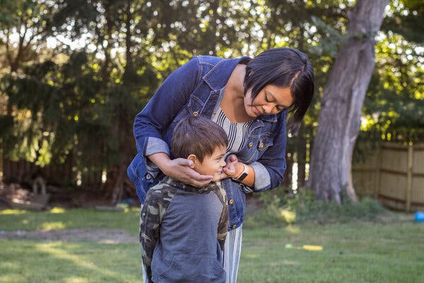 Leng Vong Reiff, 35, with her son Quentin, 5, at their home in Clive, Iowa.