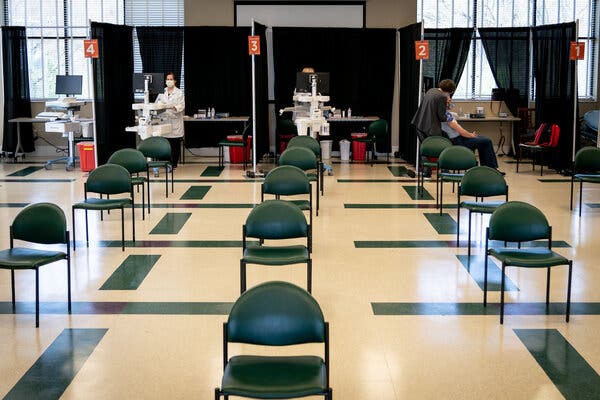 A lone person getting vaccinated in April in Elizabethton, Tenn., at a center that can accommodate 300 people a day. Several southern states are lagging in vaccinations.